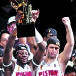 THE DETROIT PISTONS BEN WALLACE (L) HOLDS THE NBA CHAMPIONSHIP TROPHY AS HE CELEBRATES WITH TEAMMATE